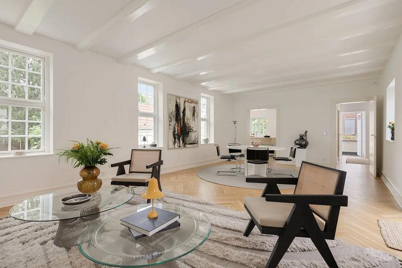Living room with bespoke chairs and glass table